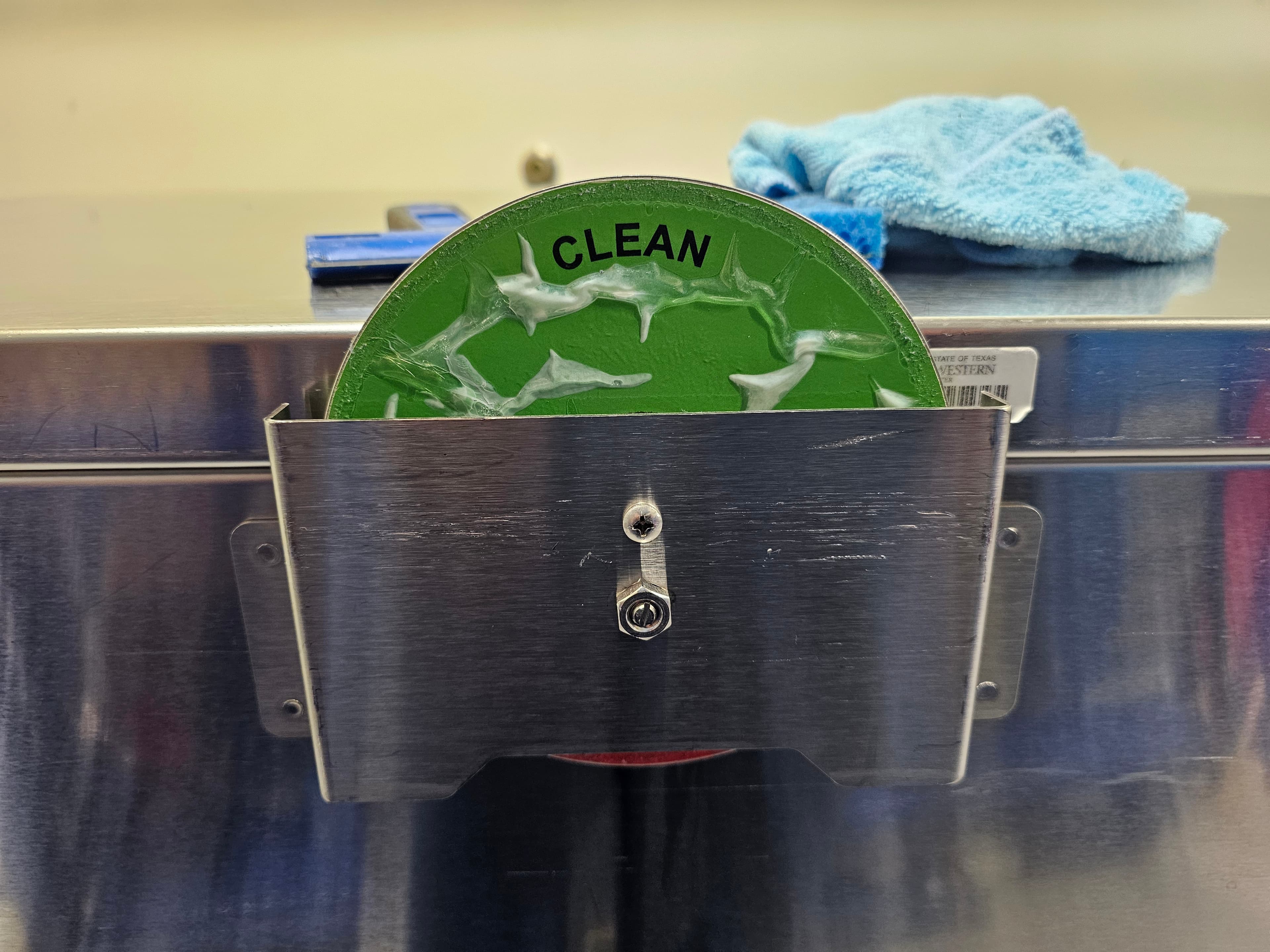 Case cart indicator wheel assembly before replacement — worn and damaged
